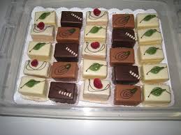 A small french fancy biscuit or cake often served at the end of a meal. Petits Fours Magdalenes Tortenwerk