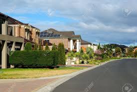 Craftsmen style modern suburban house have seen a resurgence in popularity. Suburban Street With New Modern Houses On A Beautiful Sunny Day Stock Photo Picture And Royalty Free Image Image 14466223
