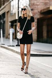 Blonde Woman Wearing Everlane Black Fitted Tshirt Frame Black Denim Skirt Outfit Celine White Trotteur Hand Fashion Jackson All Black Outfits For Women Fashion