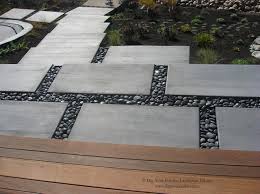 Pebbles are currently very trendy, with landscape designers using them as mulches, in mosaics and paving, and to surface paths and driveways. Modern Water Side Landscape Deck And Concrete Pavers With Polished Pebbles No Contemporary Garden San Francisco By Dig Your Garden Landscape Design