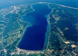 Aerial View Of Beautiful Crystal Lake With Lake Michigan At The Top And Beulah Mi At The Bottom Beulah Michigan Crystal Lake Lake Vacation Rental