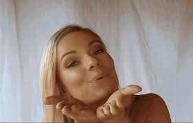 What are you supposed to do when receiving a blown kiss?