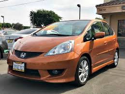 Used 2010 honda fit sport with fwd, keyless entry, fog lights, spoiler, bucket seats, alloy wheels, 16 inch wheels, cloth seats, independent suspension, rear bench seat, and compact spare tire. Sold 2010 Honda Fit Sport In South Gate