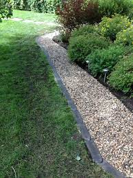 Bullet Edgers And River Stone To Outline A Garden Area Gravel Landscaping Garden Edging Gravel Patio