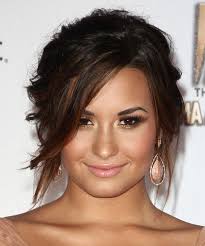 Dark red lipstick sealed off demi lovato's vampy look. Demi Lovato Long Curly Dark Mocha Brunette Updo With Side Swept Bangs And Red Highlights