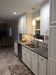 Gentle curve stainless steel pulls. Diamond Cabinets Coconut Houzz