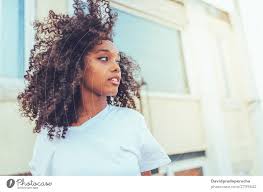 Blueberry bliss hair growth collection. Young Beautiful Black Woman On The Stairs Posing A Royalty Free Stock Photo From Photocase