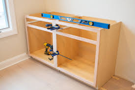 How To Install Diy Built In Cabinets The Diy Playbook Installing Kitchen Cabinets Built In Cabinets Pre Built Cabinets