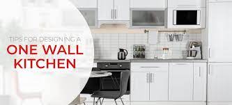 Another brilliant idea to have 2 tones cabinets for your one wall kitchen area. One Wall Kitchen Layouts Design Tips Inspiration
