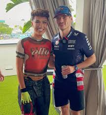 A femboy posing for a photo with a...