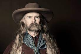Portrait Of Man With Long Hair Wearing Cowboy Hat Long Hair Styles Men Cowboy Hats Long Hair Styles