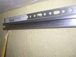 The rails have many holes so there's always a hole over a wall stud. Installing Ikea Upper Kitchen Cabinets 5 Steps Instructables