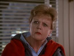 A Faded Rose Beside Her