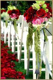 Real touch wedding flowers floral arrangements. Them Isle Decorations Are Gargantuan Red Bouquet Wedding Garden Theme Wedding Pink Wedding Decorations