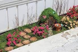 The smaller sized teacup and saucer have cute red/yellow/blue flower designs and black accents. Fairy Gardens How To Start A Fairy Garden Crafts By Amanda