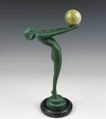 A curious art deco figurine. Rare Art Deco Le Verrier Clarte Bronze Figure Holding An Agate Ball Artedeco Online Antiques