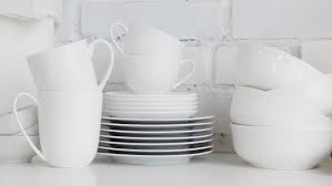 The edges of our organic shaped porcelain serveware are lightly stretched to form organic shapes that aren't perfectly rounded. Stacked White Porcelain Dishes Plates Stock Footage Video 100 Royalty Free 21913120 Shutterstock