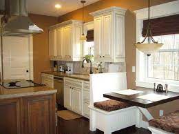 Your brown kitchen cabinets are gorgeously unique and should be shown off in all of their vintage glory. Kitchen Color Ideas White Cabinets With Wooden Floor With Brown Wall Painting Kitchen Cabinets White Kitchen Color Ideas White Cabinets Kitchen Cabinet Design