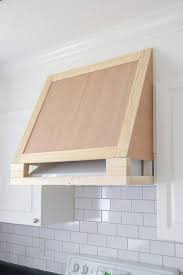 Why i never thought to just have a hood custom built at the time i will never know, but believe me, it basically, he built a a big wood box and then figured out the angles to cover the existing hood. Diy Range Hood Cover Angela Marie Made