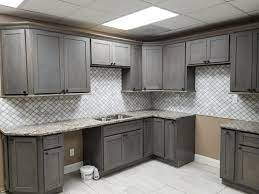 Our storm grey kitchen cabinets are frameless with ¾ thick plywood and white interiors. Our Kitchen Cabinet Home Tour New Home Improvement Products At Discount Prices