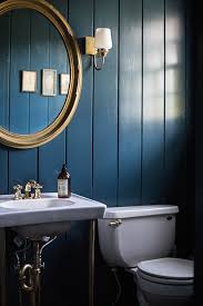 Dark Blue Walls And Gold Accents In The Bathroom Painting Wood Paneling Dark Blue Walls Wood Paneling