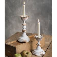Wooden holders in a colonial style can be hung on the wall or free standing and hold our taper candles. Distressed White Metal Taper Candle Holders Set Of 2 Gracefully Restored Home