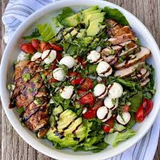 Toss chopped romaine lettuce, cherry tomatoes sliced in half, chopped red onion and avocado (if you happen to have it on hand) in a big bowl. Italian Grilled Chicken Salad Around My Family Table