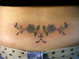 This lower back tattoo is a combination of both evil and angel. 25 Cute Lower Back Flower Tattoos For Girls Entertainmentmesh