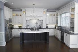 white kitchen island with granite top
