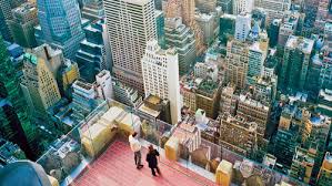 To help revitalize midtown manhattan. Top Of The Rock Observation Deck At Rockefeller Center