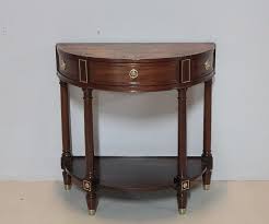One may be used as an accent table for displaying accessories or other decorative items, or hold a small lamp in an area that needs additional lighting, such as a hallway or entryway. Antique Mahogany Half Moon Console Table For Sale At Pamono