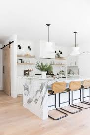 Look At How The Slab Of Marble Runs Down The Floor In This Stunning Kitchen Island Modern Farmhouse Kitchens Marble Kitchen Island Home Decor Kitchen