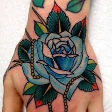 Blue Rose Tattoo On Hand Blue Rose Tattoos Traditional Rose Tattoos Hipster Tattoo