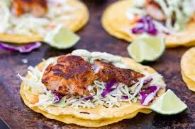 Crispy fried baja fish tacos with crunchy cabbage, fresh pico de gallo, and creamy white sauce all finished with tangy lime! Traeger Blackened Fish Tacos Healthy Grilled Fish Recipe