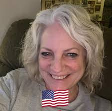 Jones Memorial CEO Eva Benedict congratulates Jim Helms