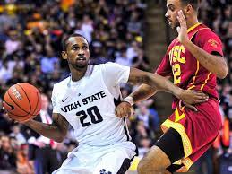 Utah State S Tenale Roland 20 Looks To Make A Pass While Being Guarded By Southern California S Julian J Utah State Aggies College Basketball Ncaa Basketball