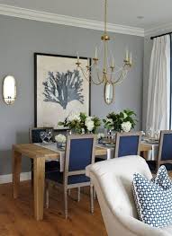 30 best dining room lighting ideas dining room walls living dining room with light gray walls light wood table and floors teal colored dining rooms love the pop of blue on grey walls as Cool Designer Alert Karla Amadatsu Dining Room Blue Transitional Dining Room Grey Dining Room