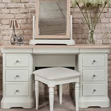 But, works just as well as a desk, a place to unload keys or mail in the entrance or to pile magazines behind the couch. Lyon Dressing Table With Mirror And Drawers Snuginteriors