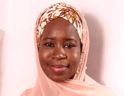 Young Female Pharmacist Presents Book