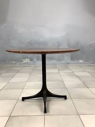 This large coffee table includes one lower drawer with silvertone metal pulls and a large open shelf for displaying photos or storing magazines. Lot Art George Nelson Herman Miller Coffee Table