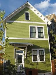 Pin By Town And Country Living On Small House Addict Green Exterior House Colors Green House Exterior Exterior House Colors Combinations
