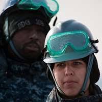 US Navy 110214-N-5339K-094 Culinary Specialist 3rd Class John Crozier,  left, and Seaman Josh Abernathy heave a line aboard the guided-missile  destr