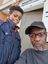 My grandson holding something cool.