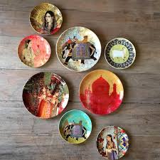 Create Beautiful Displays With Wall Plates Plates On Wall Plate Wall Decor Pottery Painting Designs