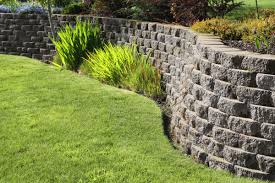 A retaining wall might be just what your landscape needs to create a solid foundation for a steep slope or enclosed decorative garden. Retaining Wall Ideas Wood Stone Concrete This Old House