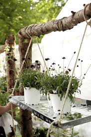 Hanging Shelf With Plants For A Garden Market Displays Farmers Market Display Flower Market