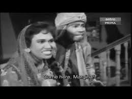 Ramlee and his wife, saloma, star as lovers and even sing together. Wn Bujang Lapok