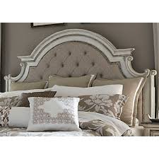 This magnolia manor king upholstered bedroom set by liberty furniture features a european traditional style made of poplar solids and white oak veneer tops and birch veneers with a combination in curvaceous frames and moldings with bracket feet in a distressed antique white finish, that will for sure give an elegant look to your bedroom and will make the perfect relaxing atmosphere to lie up. Magnolia Manor Upholstered Bed Star Furniture