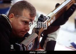 Right side profile medium close-up shot as U.S. Ambassador to Mozambique, Dean  Curran, Left, and U.S. Air Force Major. General Joe Wehrle (Center),  commander of Joint Task Force Operation Atlas Response, discuss