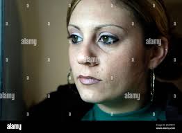 In this May 10, 2010 photo, Amanda Henderson poses for a photo at her home  in Winfield, Mo. William Henderson, a 29-year-old welder from rural  Missouri, left his wife Amanda and three